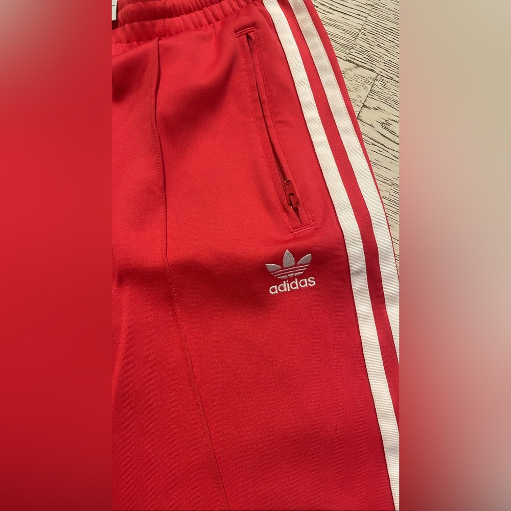 Adidas track pants in size small with zipper ankle details